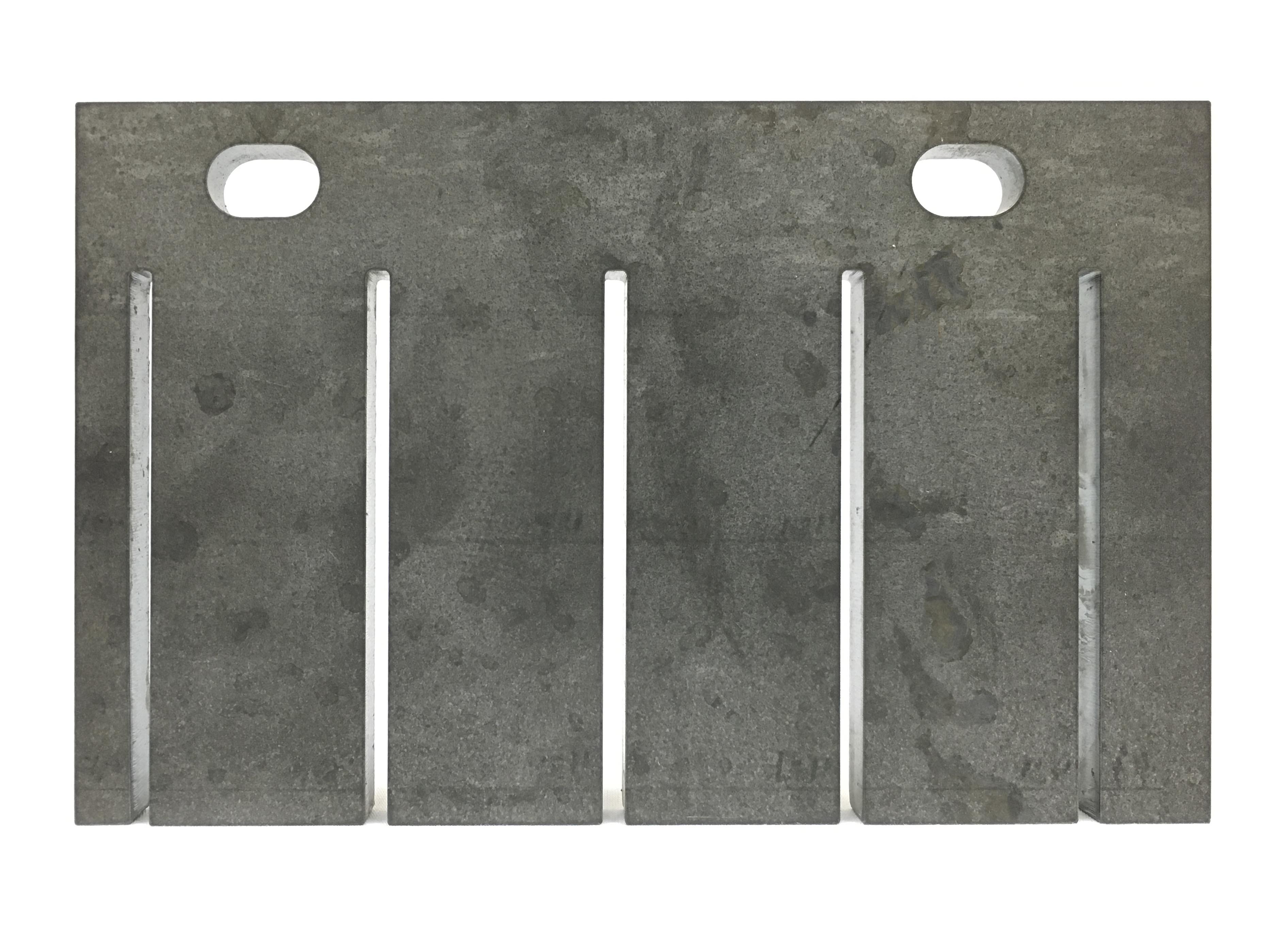 Carbon Steel - ⅜ in. plate—4 ½ in. x 7 in. with (2) equal round slots and (5) equal rectangular slots